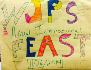 Students gathered to draw the International Feast posters to let other students know about  the upcoming event. Most students in school will be able to bring in food or supplies to the feast. Photo by Da Hae Jung