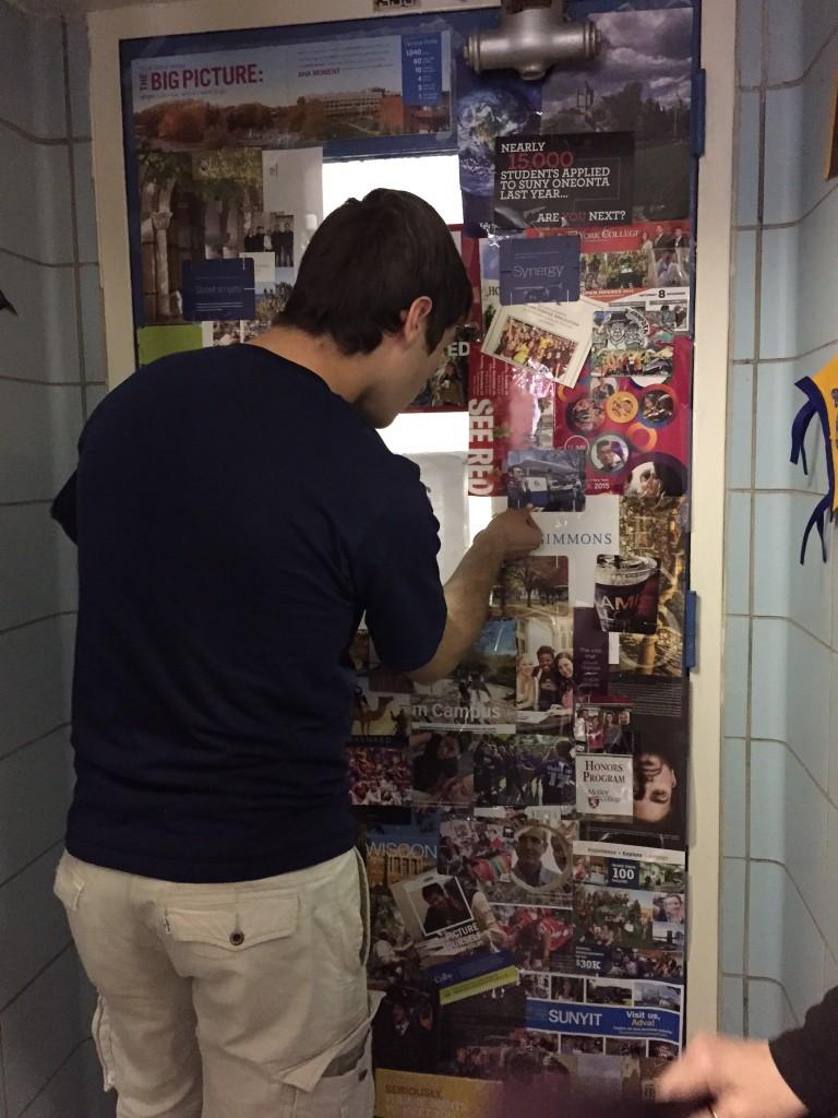 Students decorate their second period class door with college themes for college week. 