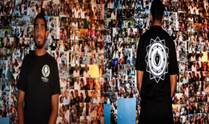 In the picture above, Leonel Salcedo is shown wearing the latest CrossHeart Industry t-shirt that was designed by Bryan Nieves, the companies graphic designer. Additionally, on the wall, Salcedo portrays a collage of fond memories of himself with his friends.Photo provided by Leonel Salcedo.