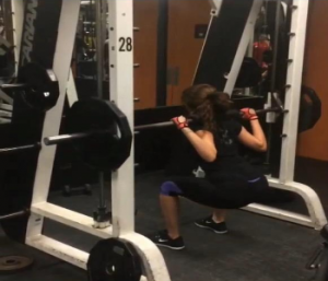 Squatting on the Smith Machine is a great way for beginners to introduce themselves to the change from doing bodyweight squats to doing back squats. Photo by Faith Chojar.  