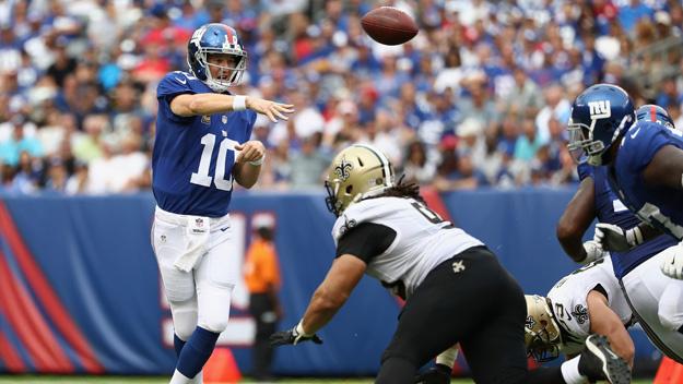 EAST RUTHERFORD, NJ - SEPTEMBER 18:  Quarterback  Eli Manning #10 of the New York Giants throws a pass against the New Orleans Saints during the second half at MetLife Stadium on September 18, 2016 in East Rutherford, New Jersey.  (Photo by Elsa/Getty Images)