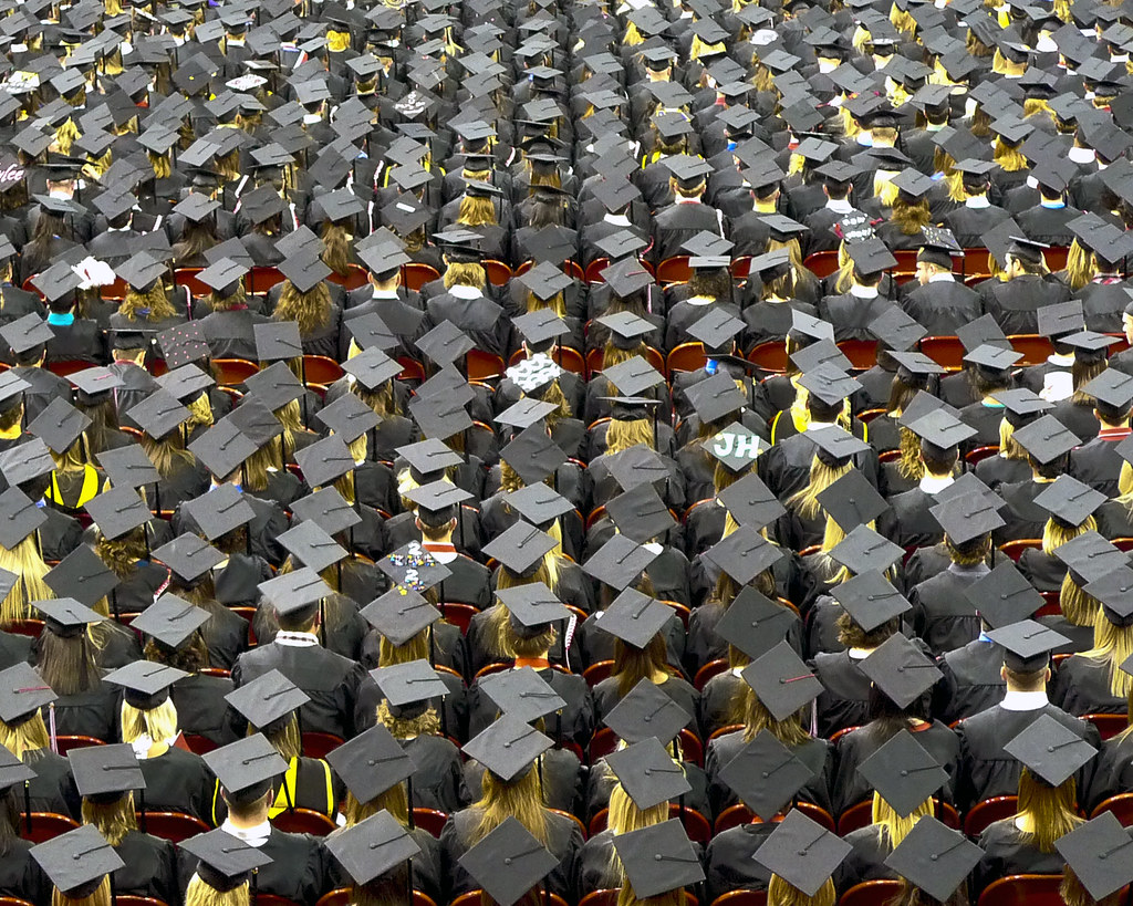 "graduation caps" by j.o.h.n. walker is licensed under CC BY 2.0.
